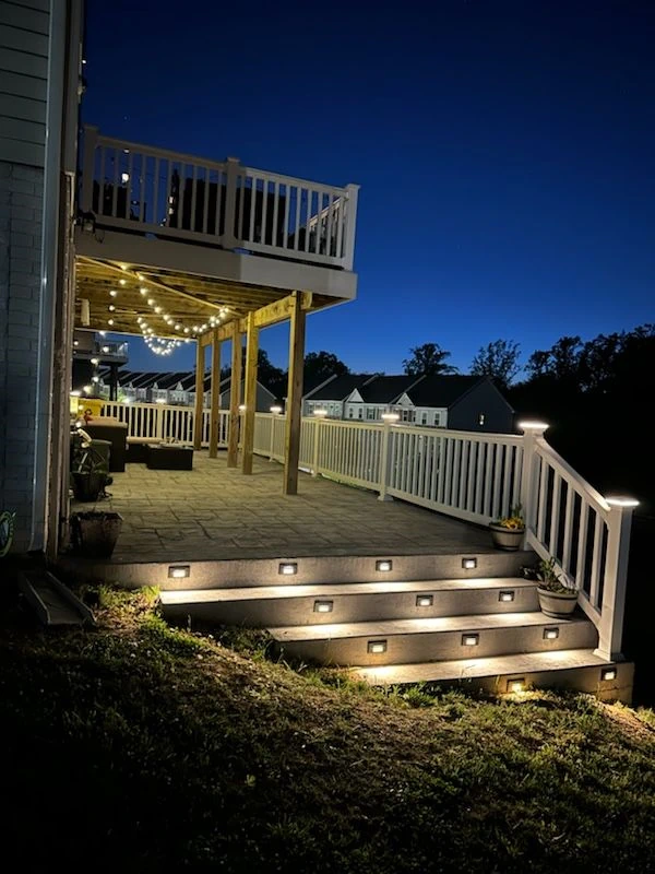 Concrete patio with lightning and decorative elements