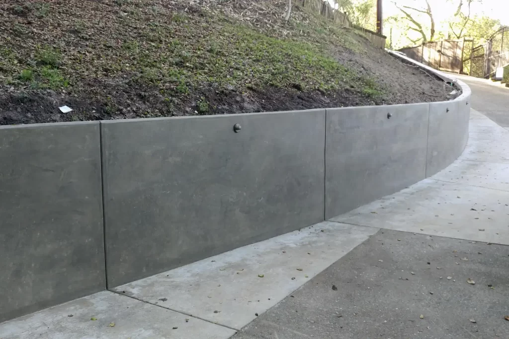 Concrete retaining wall on a slide
